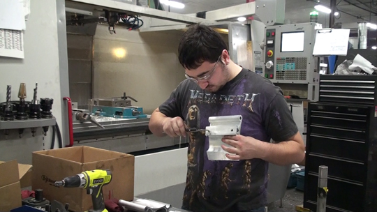 Employee working on part