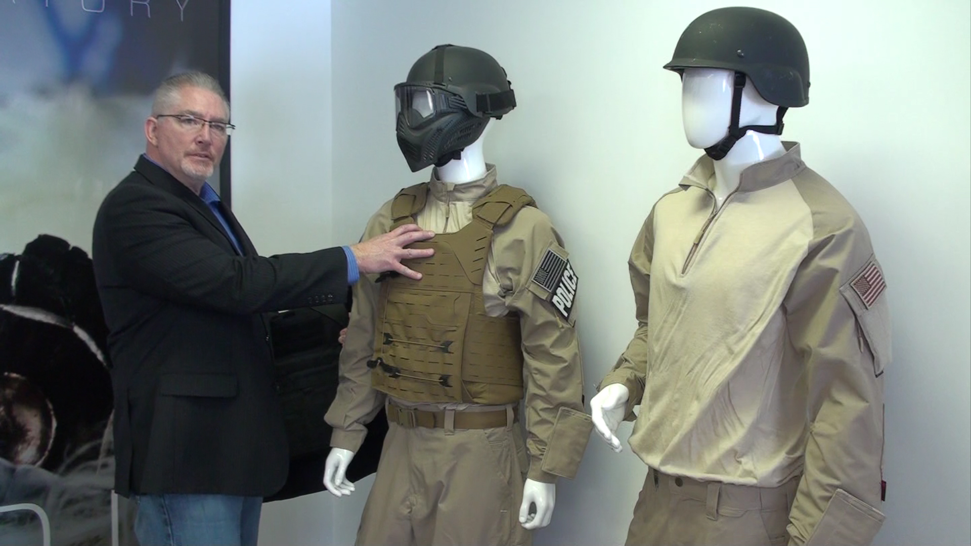 Todd Olson with two mannequins wearing Armor Express gear on his left. 