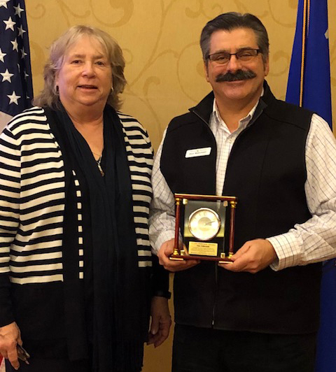 Don Makowski posing with his WPI’s Silent Partner Award with woman on his right.
