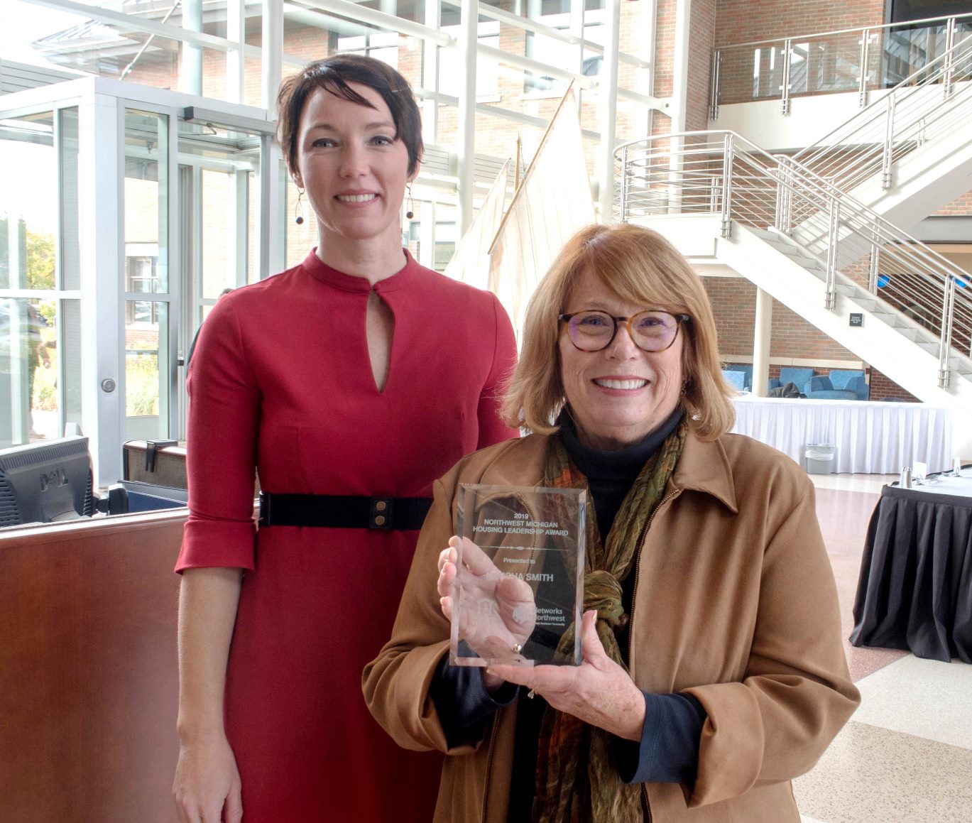 Marsha Smith holding Housing Leadership Award